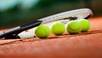 Close up view of tennis racket and balls