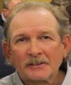 A picture containing person, person, suit, posing

Description automatically generated