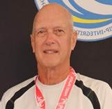 A person with a lanyard around his neck

Description automatically generated