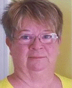 A person wearing glasses and a yellow shirt

Description automatically generated